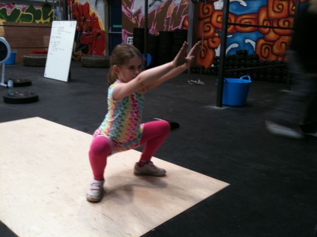 Jadzia doing Crossfit Kids' squats