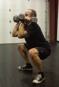 DB Hang Squat Clean in the squat position